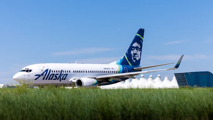 Alaska Airlines airplane taxis at DEN.
