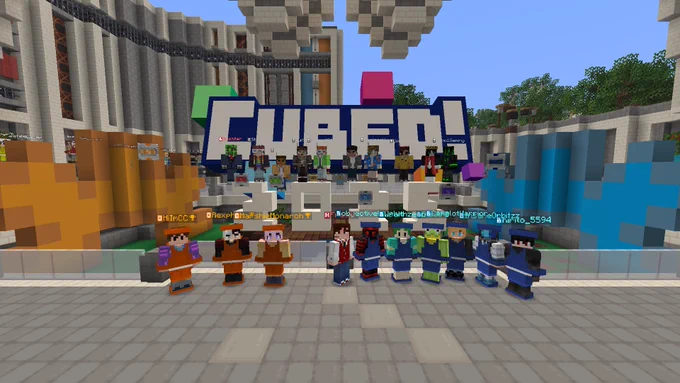 The cast and crew of Gameshow Showdown Live Episode 12, standing in front of the "Cubed! 2025" statue in the Factory grounds.