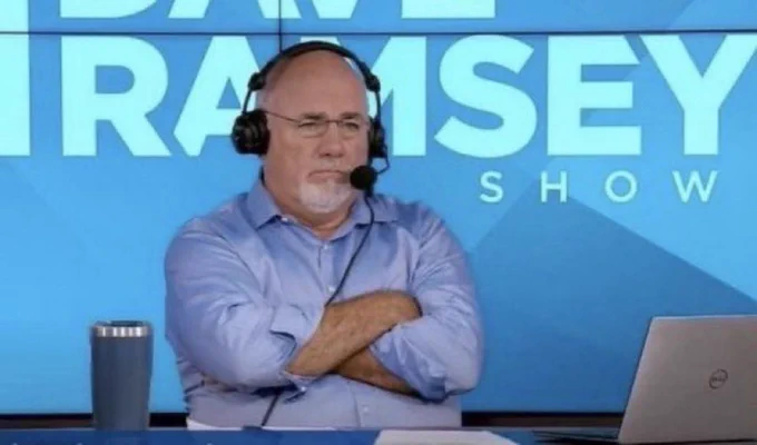 Dave Ramsey wearing a headset on the set of his show with his arms crossed looking quizzically at his screen hearing about people’s poor financial decisions.