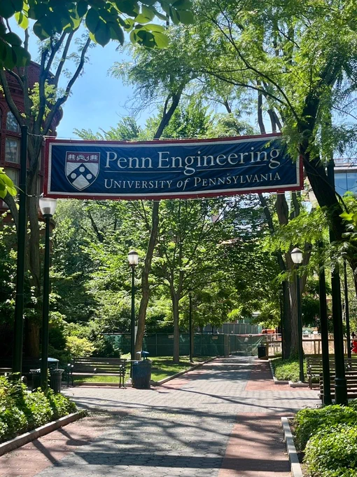 A banner on the University of Pennsylvania campus with the university's crest and the text "Penn Engineering; University of Pennsylvania"