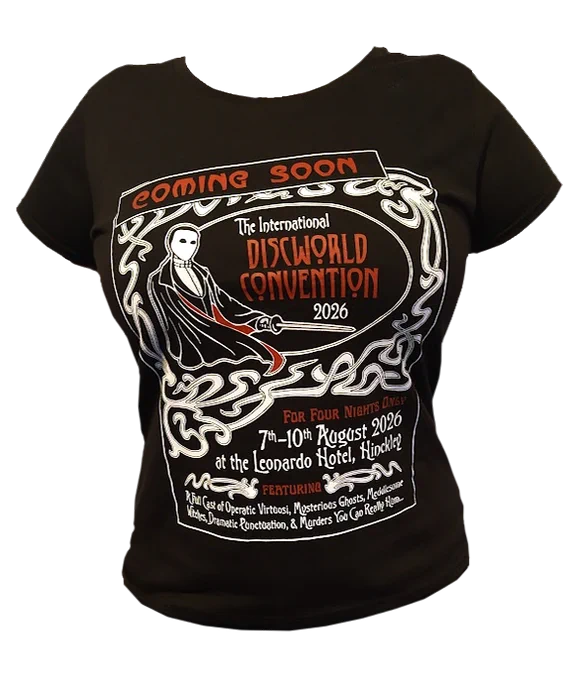 A photograph of a black ladies fit t-shirt with the design for the 2026 International Discworld Convention printed on the front in white and red.