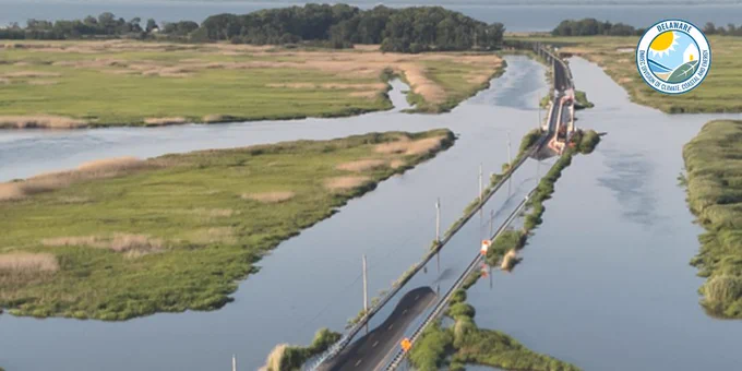 Flooding hampers travel on a roadway.