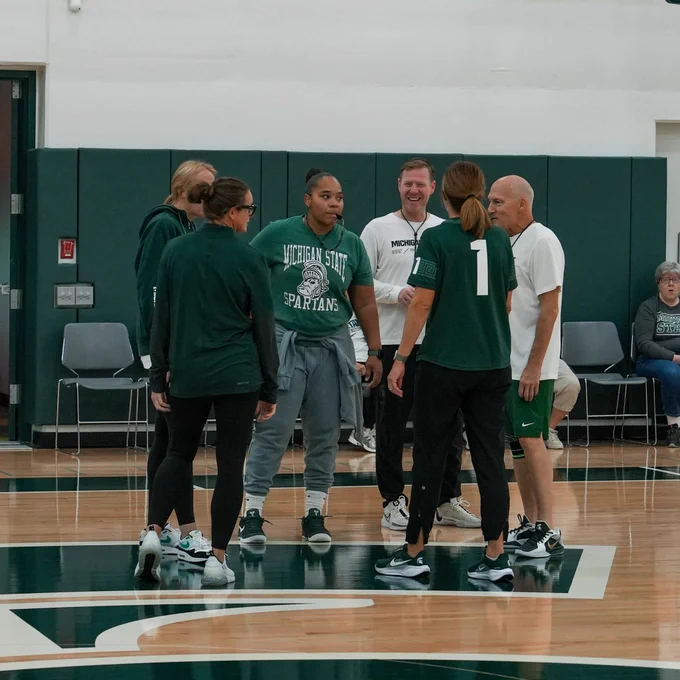 Coaches practice huddle