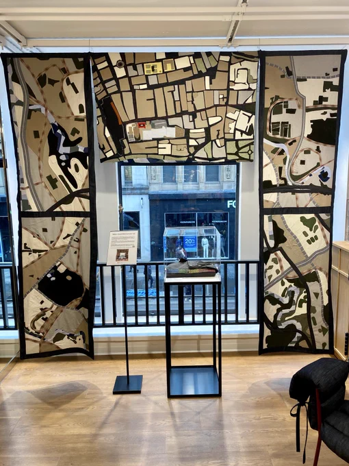 This is the tapestry of pre-loved clothing made in a collaboration between Uniqlo and Govanhill Baths Community Trust. Each panel represents a map of a different area of Glasgow. The tapestry is located on the first floor of the new Uniqlo store on Glasgow’s Argyle Street with the street scene in the background.