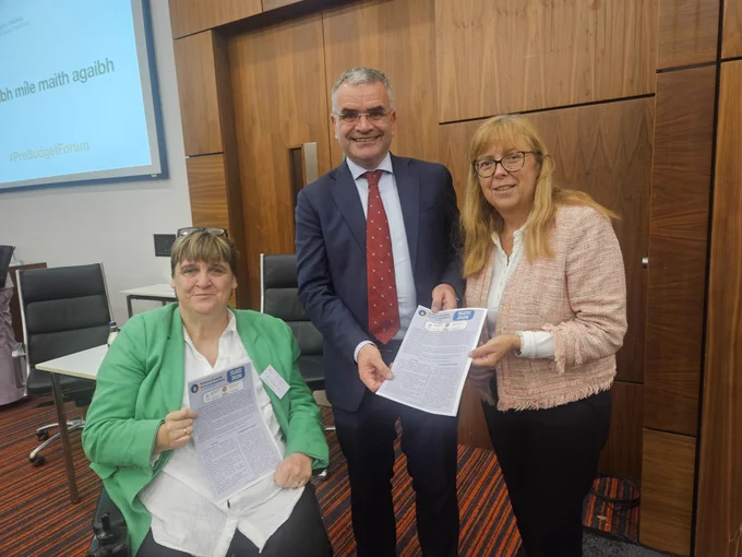 Photograph of Joan Carthy, Chair of NDSA Committee Sub-Committee and Emer Costello with the MInister for Social Protection Dara Calleary