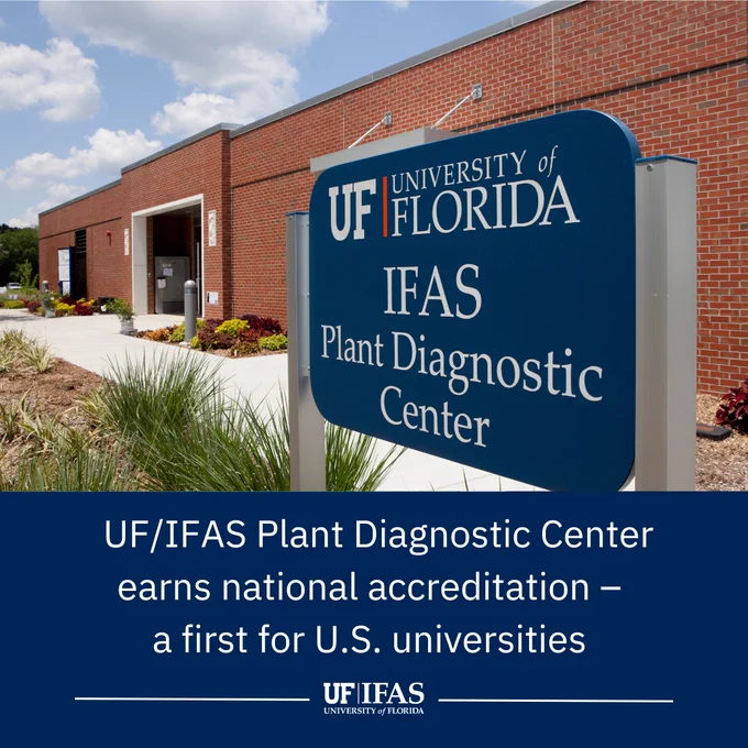 Signboard of the University of Florida IFAS Plant Diagnostic Center in front of the building. The bottom reads, "UF/IFAS Plant Diagnostic Center earns national accreditation - a first for U.S. universities." 