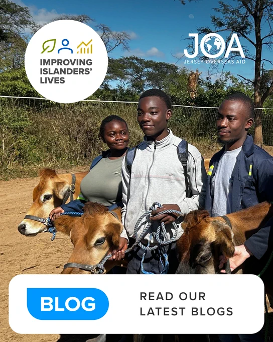 Three individuals standing outdoors with two Jersey cows, promoting Jersey Overseas Aid's mission with a 'Read our latest blogs' overlay.