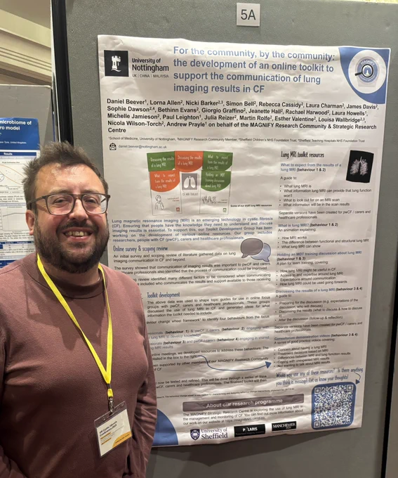 Dan stood smiling in front of his poster about development of the lung MRI toolkit.