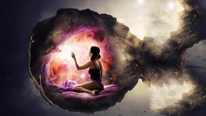 Alt text: A surreal digital artwork showing a woman sitting on a purple bed inside a glowing, cocoon-like cave or portal. She is touching a radiant, swirling light resembling a nebula or galaxy that fills the space before her. The cave’s outer surface appears cracked and dark, contrasting with the vivid cosmic colors within. Outside the cocoon, the background is misty and ethereal, with faint lights and shapes suggesting another world or dimension.