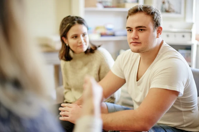 Image courtesy of GettyIamages [Mikolette]
A couple talking with a counsellor.