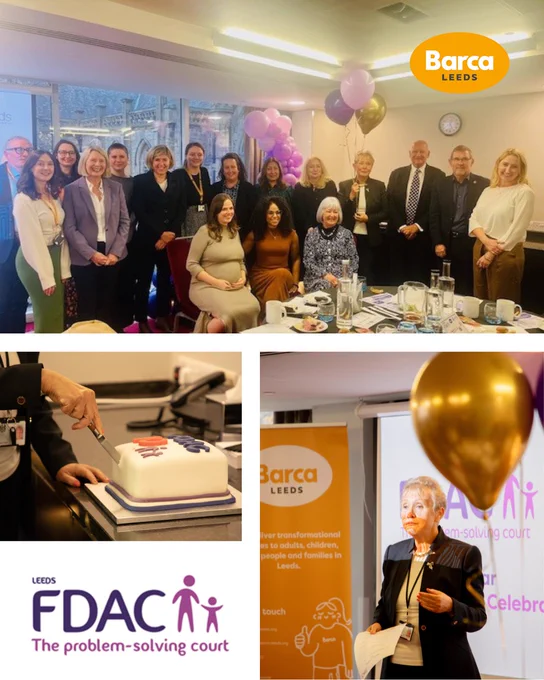 A group of people at a celebratory event with balloons and a cake featuring the FDAC logo. A speaker addresses the audience.