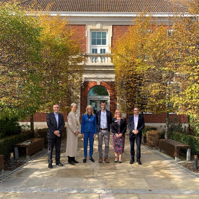 APHA and Defra colleagues gather outside of APHA's Weybridge headquarters. L-R: Jason Field APHA Director of Science (Operations and Research), Elizabeth Buchanan, APHA Lead Non-Executive Director, Professor Christine Middlemiss, UK Chief Veterinary Officer, Dr Richard Lewis, APHA Chief Executive, Yvonne Spencer, APHA Director of Science Capability and Dan Horton APHA Interim Director of Science Capability.