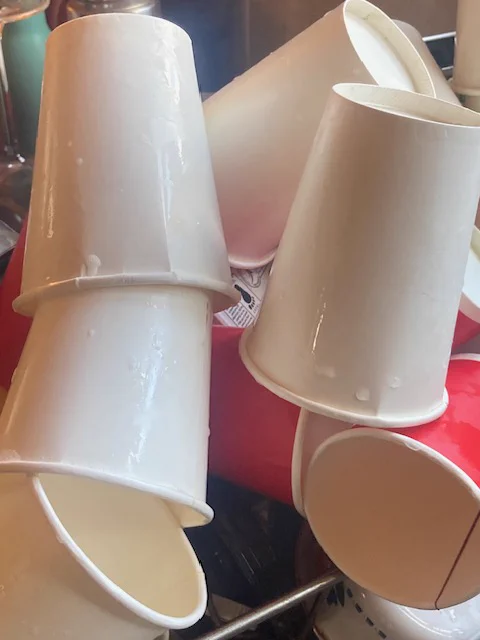paper coffee cups washed and in a heap