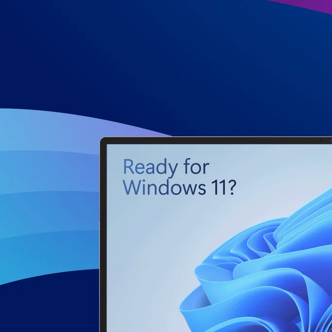 A blue gradient against a dark blue background. On the right side of the frame is a computer screen with blue text that reads "Ready for Windows 11?"