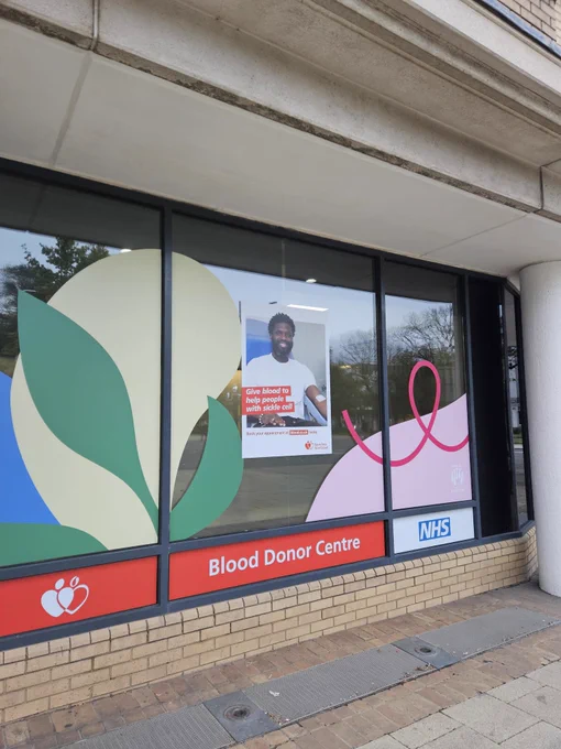 The outside of the new blood donor centre in Brighton with bright colourful patterns on the windows