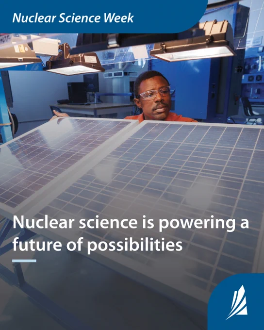 Man stands behind solar panel, examining it in a science lab. Graphic text reads “Nuclear science week. Nuclear science is powering a future of possibilities.”