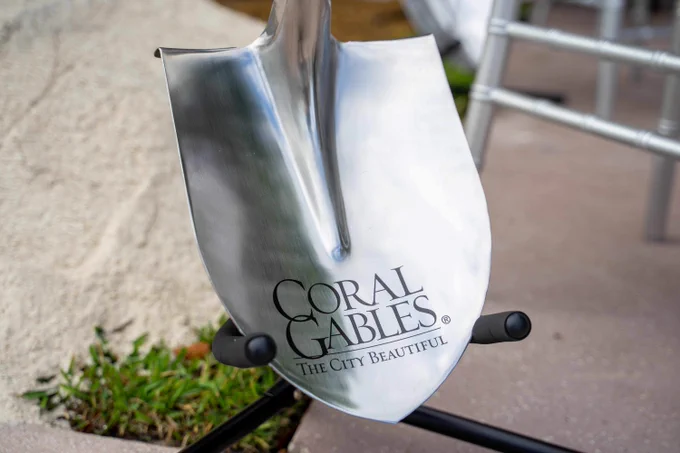 Close-up of a shovel head featuring the Coral Gables logo.
