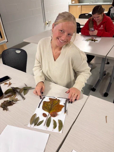 OTD student, Abby Archer, smiling with her nature based activity