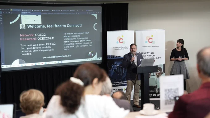 This post includes several photos from Connected Canadians’ workshop held at the Ottawa Conference and Event Centre. The images show older adult participants, working 1:1 with Connected Canadians technology mentors, workshop facilitators delivering the presentation, and group photos of members of the Connected Canadians team.