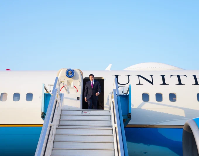 Secretary Rubio exits a plane in Israel on October 23, 2025. The Secretary of State seal is displayed on the airplane door to the left of Secretary Rubio. (State Department/Freddie Everett)