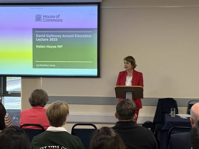 Helen Hayes MP with the first two rows of people giving a lecture