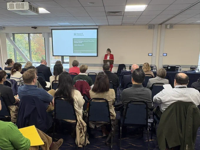 Helen Hayes MP giving a lecture to a room full of people
