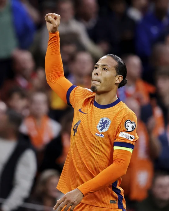 Photography of Virgil van Dijk celebrating his goal against Finland.