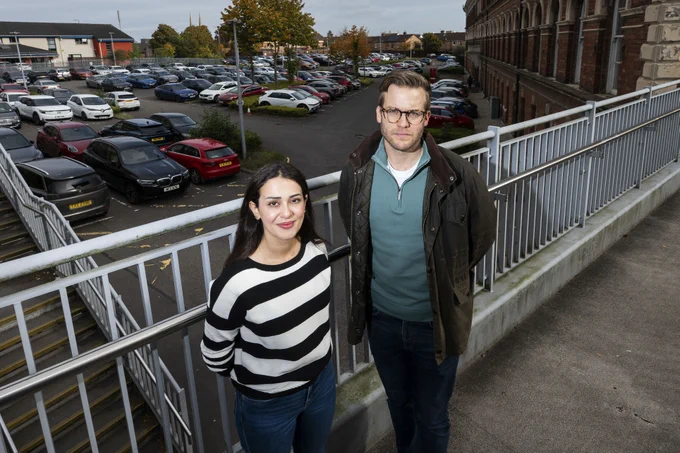 Image shows Mrs Rawan Alhattab and Dr Dan Middleton. There is a carpark in the background.