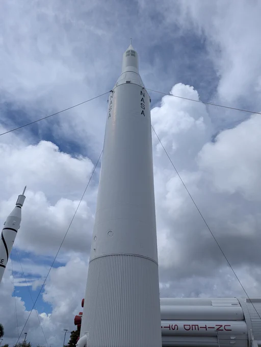 A large white rocket with the letters NASA on the side.