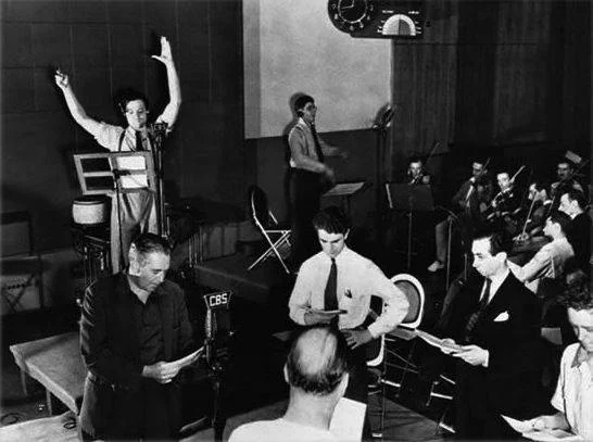 Orson Welles (left) rehearses his radio depiction of H.G. Wells's "The War of the Worlds"