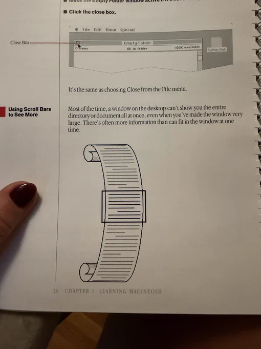A page from the “Learning Macintosh” chapter of the Macintosh user guide. It says “Most of the time, a window on the desktop can't show you the entire directory or document all at once, even when you've made the window very large. There's often more information than can fit in the window at one time.” With a MacPaint-generated papyrus scroll featuring a square demonstrating the visible content.