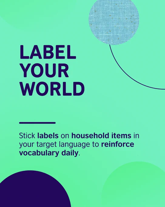 Decorative shapes. Text says: Label your world. Stick labels on household items in your target language to reinforce vocabulary daily.