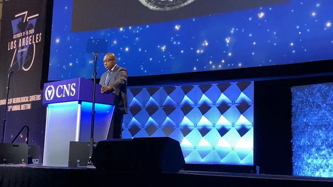 Shawn Hervey-Jumper, MD, at the podium presenting his talk.