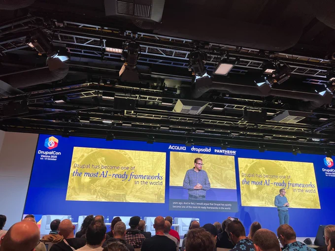 Dries presenting at DrupalCon Vienna 2025 about Drupal becoming one of the most AI-ready frameworks globally, with a large audience watching.