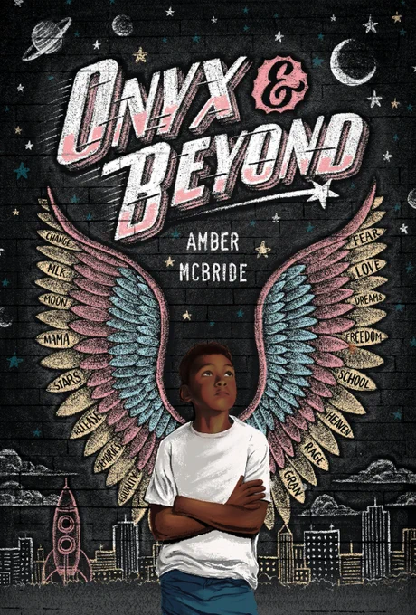 Book cover for "Onyx & Beyond" By Amber McBride. A boy stands in front of a chalkboard. Behind him is a small city, space ship, stars, and wings coming out of his back. He is looking up at the title and wearing a white shirt and jeans. 