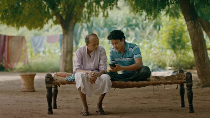A farmer and student in rural India access crucial insights through an AI-driven platform on their mobile device. 