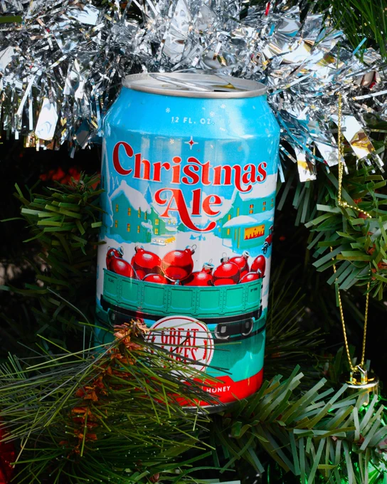 Christmas Ale by Great Lakes Brewing Co. nestled among the branches of a Christmas pine tree.