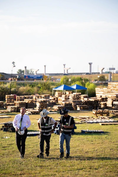 President Keller walks to the build with members of the Talon. 