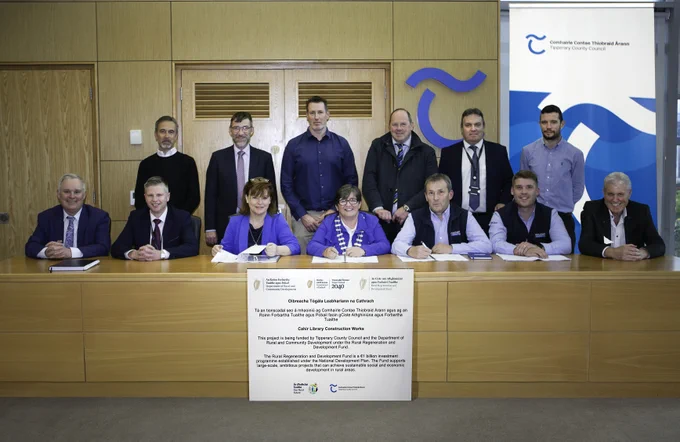 A photo of County Council staff and members of Mulcahy construction.

Back: Robin Lee, Director, Robin Lee Architecture, Anselm McGowan, District Administrator, James Swords, District Engineer, Cllr Andy Moloney, Kieran Laddan, SEE, Tipperary County Council, Frank Cussen, Project Engineer, Tipperary County Council.

Front: Damien Dullaghan, County Librarian, Damien Ginty, District Director, Sinead Carr, Chief Executive, Cllr Marie Murphy, Leas Cathaoirleach, Joe Mulcahy, Mulcahy Construction, David Mulcahy, Mulcahy Construction, Cllr John Crosse