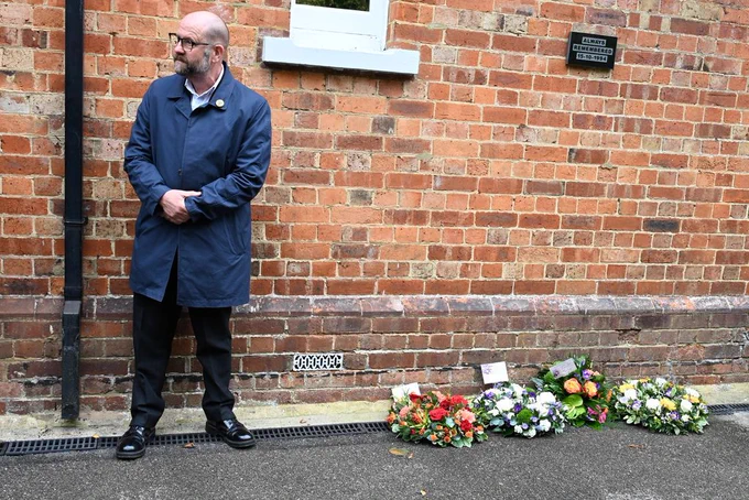 ASLEF AGS Simon Weller standing next to the laid wreaths at Cowden Station