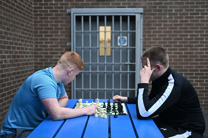 Pictured are young offenders at Hydebank Wood College are turning to chess as a distraction from the isolation of prison life.