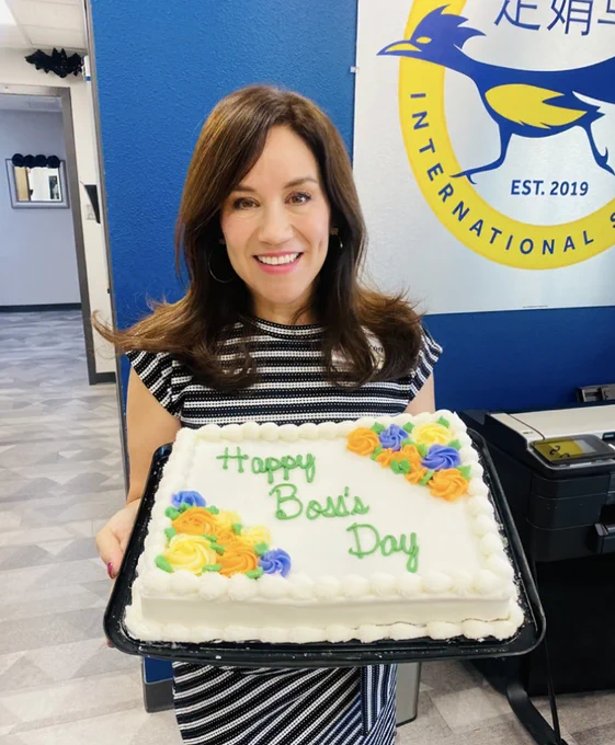 Mrs. Licon holding a cake