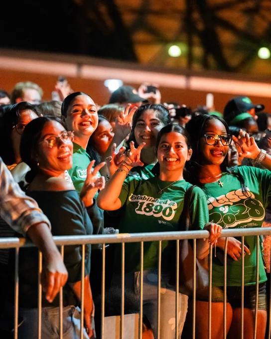 UNT students watch the Homecoming Bonfire.