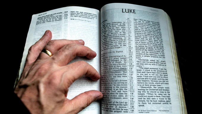 A Bible open at the gospel of Luke
