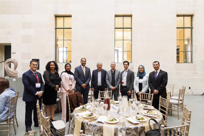 Attendees pose for a photo with Dr. Victor Dzau, president of the National Academy of Medicine. 