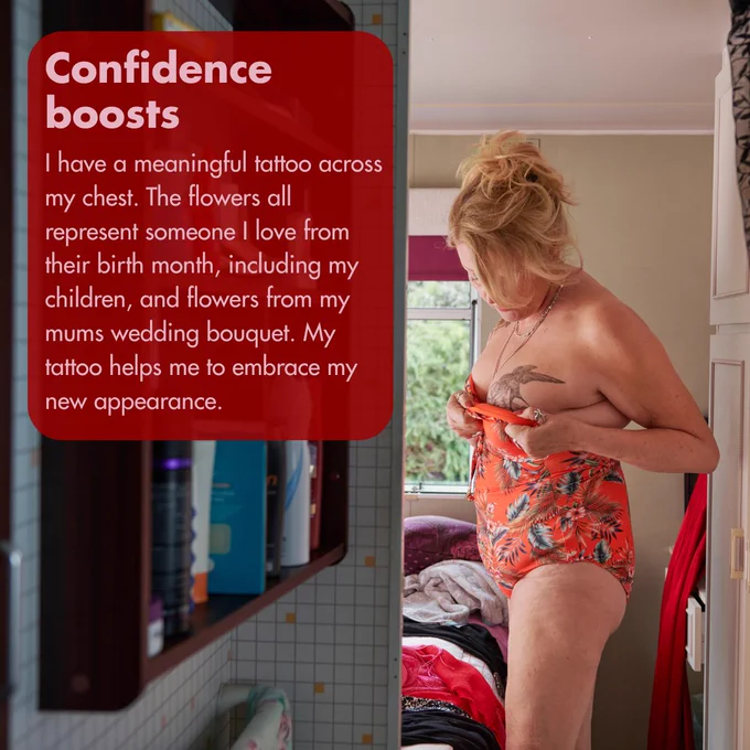 Image of a woman getting dressed into a flowery swimsuit, you can see a tattoo across her chest. Text reads, 'Confidence boosts - I have a meaningful tattoo across my chest. The flowers all represent someone I love from their birth month, including my children, and flowers from my mums wedding bouquet. My tattoo helps me to embrace my new appearance.' 