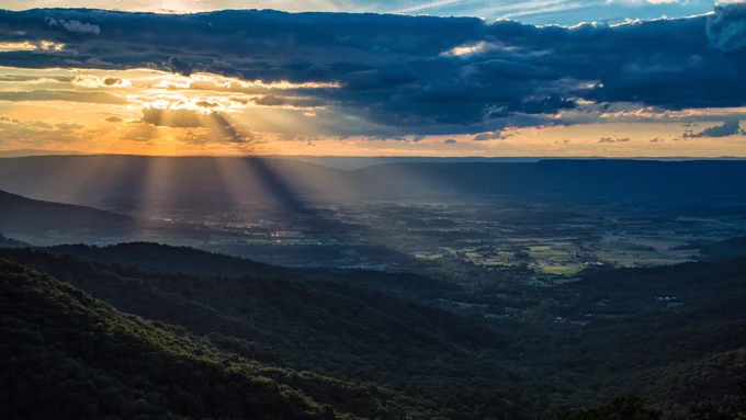Sunbeams shinning through clouds seen from Shenandoah National Park, Virginia. 