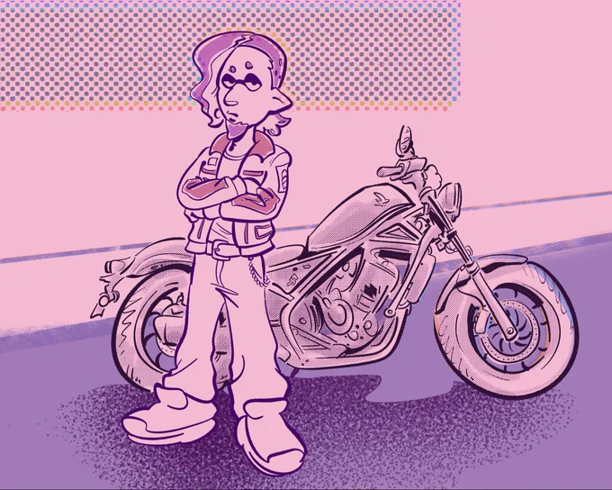 Ikkan standing by a classic motor bike