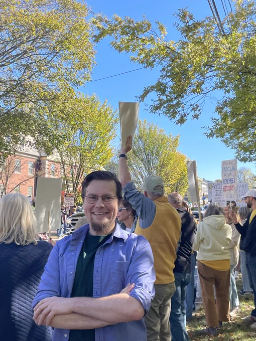 Bethany Andres-Beck smiling in a crowd of protesters in Newburyport