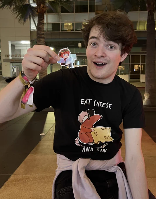 Tubbo holding a tiny version of himself in the form of a sticker